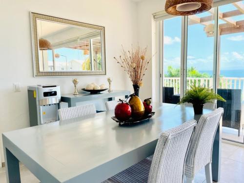 a dining room with a table with fruit on it at Paradise Retreat Peace Relaxation in Santa Bárbara de Samaná
