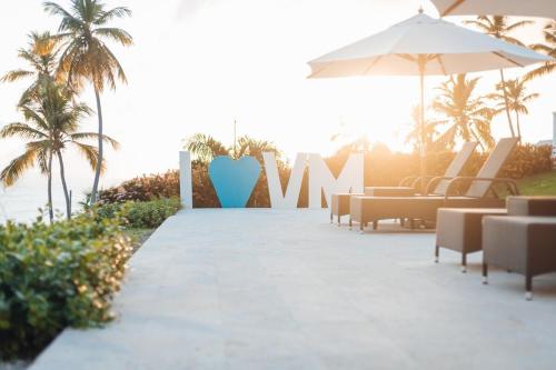 a resort with chairs and a sign that reads wow at Saman - Paradise With A View - Vista Mare in Santa Bárbara de Samaná