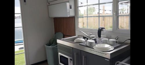 Kuchyň nebo kuchyňský kout v ubytování Lakeside Wevelgem