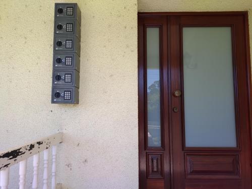 a door with a speaker next to a building at CRALS - Casa do Corgo in Barroselas