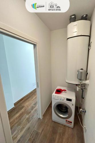a laundry room with a washer and dryer in it at Comacchio Experience - Ospitalità Diffusa in Lido di Pomposa