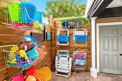 a wall with several baskets and trays of toys at Boutique Beach Retreat in St Pete Beach