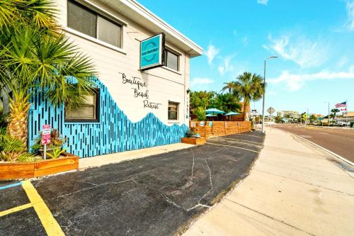 a building with a sign on the side of it at Boutique Beach Retreat in St Pete Beach