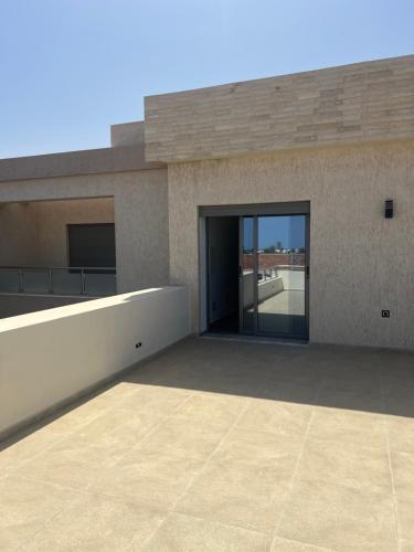 a large building with a large glass door at Villa - Djerba in Midoun