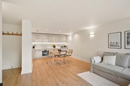 a living room with a couch and a table at Flat 315, 33 Birtton Street in London