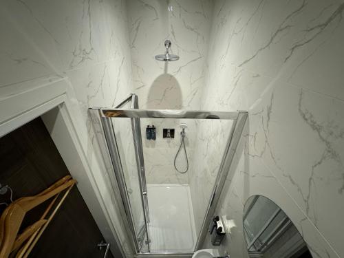 a bathroom with a shower and a sink at Luxury 6-Bed House - 6 En Suite- Jaquzzi Baths - Private Parking - Sleeps 22- 2 Min M62 in Elland