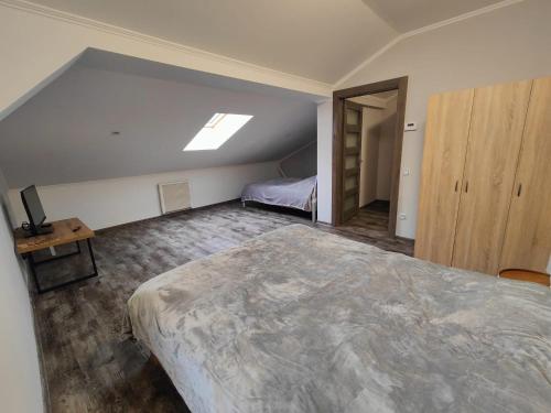 a bedroom with a large bed in a room at Villa Pirken Hammer in Pirkenhammer