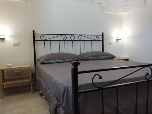 Ένα ή περισσότερα κρεβάτια σε δωμάτιο στο Trulli La Quercia del Nonno