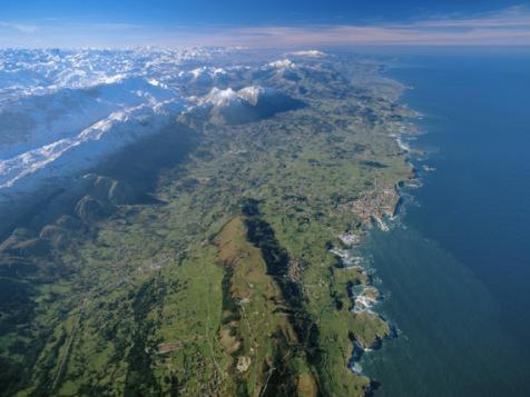 an aerial view of an island in the water at Hotel Ciudad Cangas de Onis in Cangas de Onís