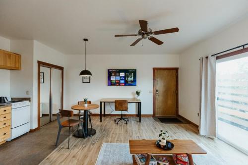 a living room with a ceiling fan and a table at Mt Jackson Suite Close to Logan Health in Kalispell