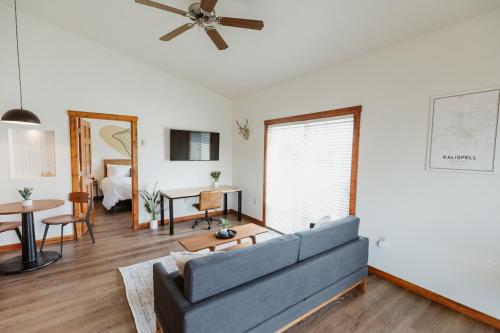 a living room with a couch and a table at Mt Cleveland at Switchback Suites in Kalispell
