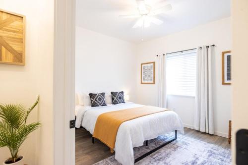 a bedroom with a bed and a ceiling fan at Modern Townhome Enclosed Garage WD in Kalispell