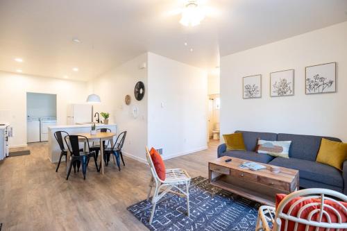 a living room with a couch and a table at Modern Townhome Enclosed Garage WD in Kalispell