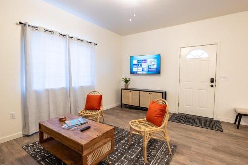 a living room with two chairs and a table at Modern Townhome Enclosed Garage WD in Kalispell