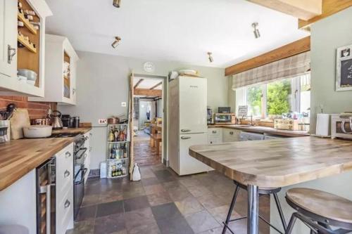Kuchyň nebo kuchyňský kout v ubytování Penny Cottage