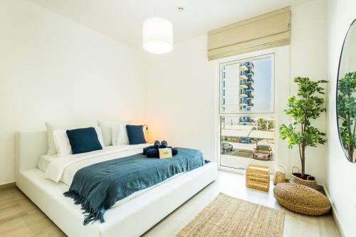 Ένα ή περισσότερα κρεβάτια σε δωμάτιο στο Cozy 1br Apartment In Waters Edge, By Voyage