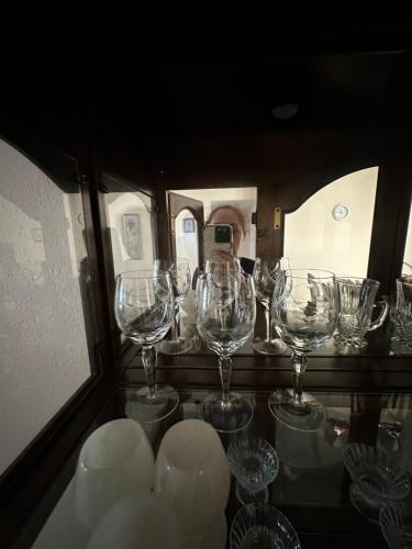 a group of wine glasses sitting on a table at Tranquility Home near Beaches in Palm Coast