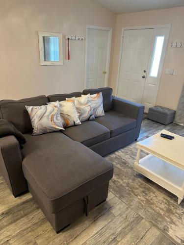 a living room with a couch and a coffee table at Tranquility Home near Beaches in Palm Coast
