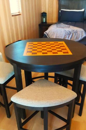 a table with a chess board on top of it at Lazy Bear Cabin 6 - Sleeps Up To 4 in O'Brien