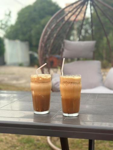 two drinks sitting on top of a table at Homestay in Batumi Дом в Чакви in Chakvi