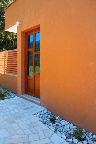 a door of a house with a stone walkway next to it at Zen Oaza in Konjic