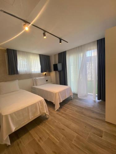 Katil atau katil-katil dalam bilik di Çağdaş Otel