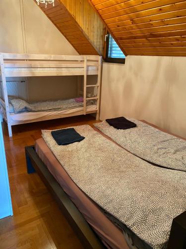 two bunk beds sitting next to each other in a room at Luxury 3 BR Vila in a forest 10min drive from city center in Budapest
