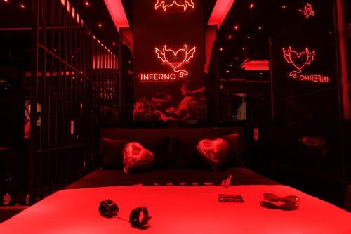 a red room with a bed with red lighting at Albicocche house Catania in Catania