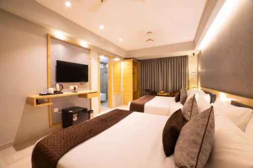Ένα ή περισσότερα κρεβάτια σε δωμάτιο στο Northin Hotel