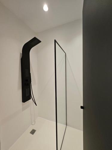 a mirror on a wall in a white room at ELLI TROPiCAL LUXURY SUITES SUNSET-INFINITY POOL- SEA SIDE-NEAR CENTER PARKING in Mikonos
