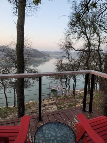 a deck with chairs and a view of a lake at Lakefront, Private Dock, Spectacular Views in Bridgeport
