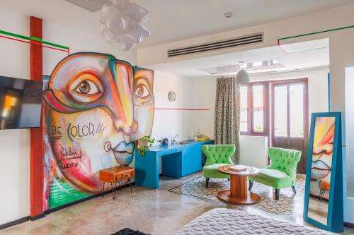 a living room with a painting of a goat at Tantalo Hotel - Kitchen - Roofbar in Panama City
