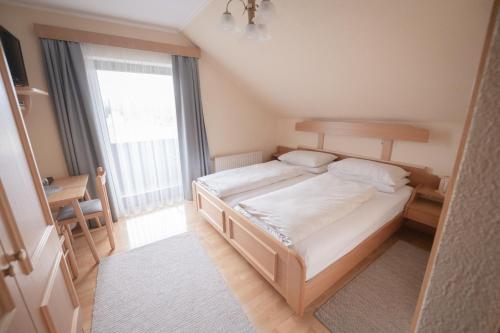 Postel nebo postele na pokoji v ubytování Gästehaus Maurer/Bader