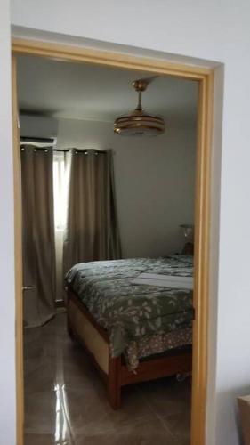 Ένα ή περισσότερα κρεβάτια σε δωμάτιο στο Luxurious Palm Breeze Studio Apt in San Isidro