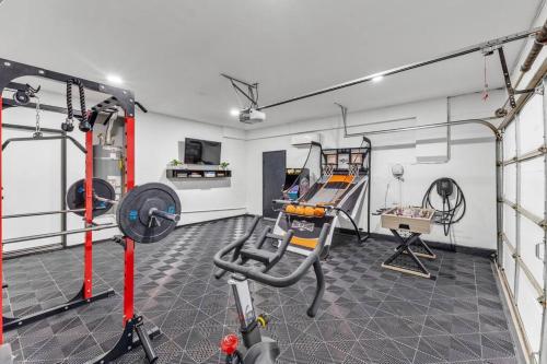 a gym with a treadmill and a treadmill at Paradise Coachella NEW Salt Water Pool & Landcape in Coachella