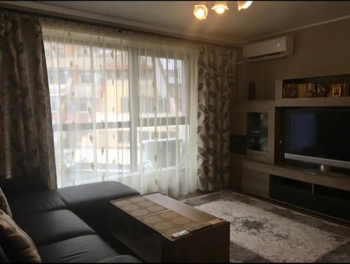 TV a/nebo společenská místnost v ubytování Charming apart next to the beach