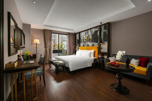 Postel nebo postele na pokoji v ubytování Hanoi Lion Boutique Hotel & Spa