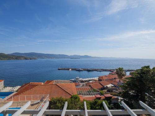 a view of a large body of water with buildings at Heliades Maisonettes in Mithymna