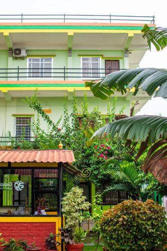 a building with a lot of plants in front of it at Galaxy Guest House in Bhairāhawā