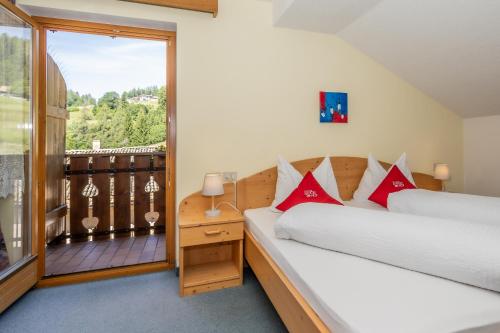 Postel nebo postele na pokoji v ubytování Hotel Langeshof