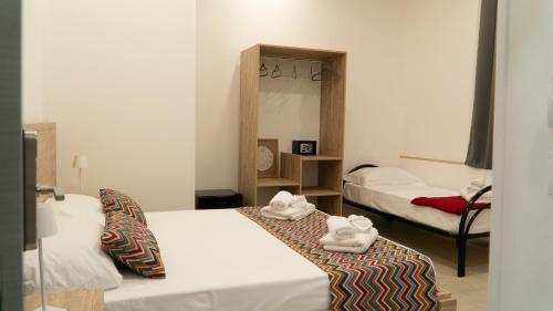 Postel nebo postele na pokoji v ubytování Frontemare 25 Beach Hotel