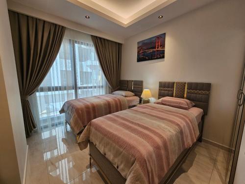 Postel nebo postele na pokoji v ubytování Cebeci Towers Luxury