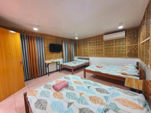 Postel nebo postele na pokoji v ubytování Genna's Tourist Inn Santa Fe