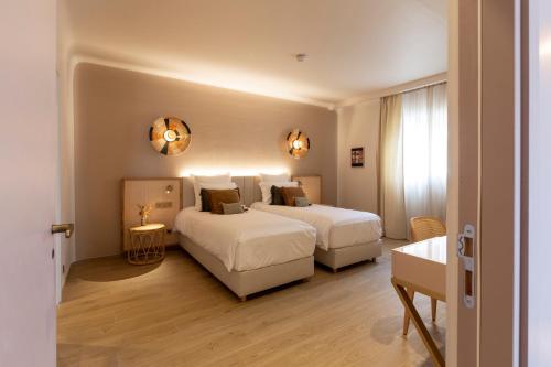 Hotel Riva Beachにあるベッド