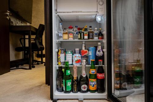 a refrigerator filled with lots of bottles of beer at Pure Boutique Hotel in Baku