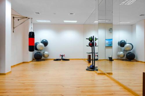 an empty room with a gym with balloons on the wall at Grand Millennium Tabuk in Tabuk