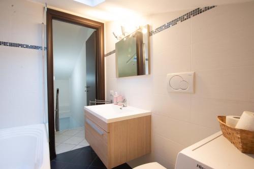 a bathroom with a sink and a mirror at CASA.AD in Bracciano