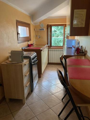 A kitchen or kitchenette at AL CLISI graziosa mansarda