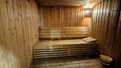 an empty wooden sauna with a toilet in it at City Tower Hotel in Fujairah