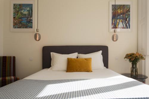Letto o letti in una camera di Vila Julieta Guesthouse